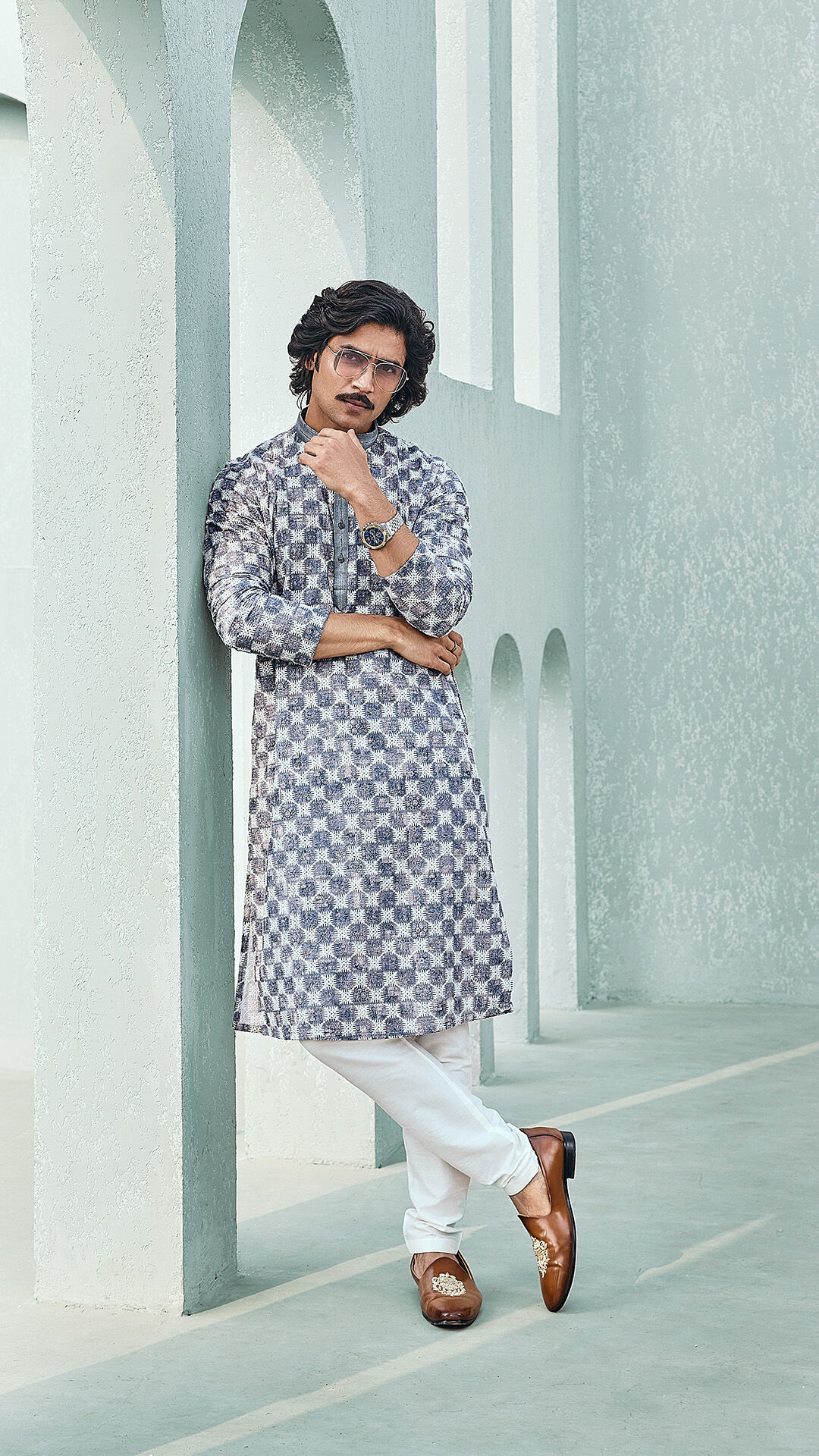 A man wearing a Blue printed Kurta Pajama set for engagement ceremony